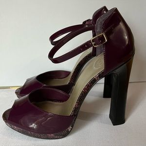 Never worn. Still in original box. Cranberry with snakeskin detail.